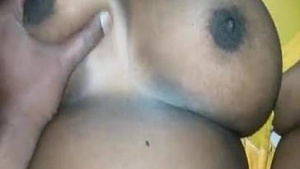 Tamil auntie with fake boobs gets naughty on camera