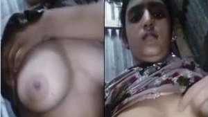 Busty Indian babe pleasures herself on camera