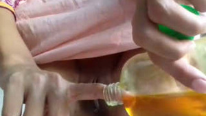 Horny amateur girl pleasures herself with mustard oil in this video