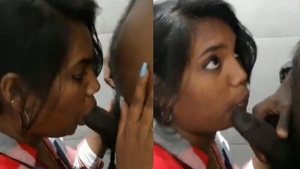 Tamil girl enjoys giving oral pleasure in the bathroom