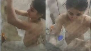 Cute girl records herself bathing on hidden camera