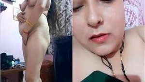 Busty bhabhi flaunts her assets in this steamy video