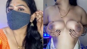 Indian woman with large breasts performs a seductive performance