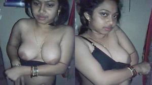Indian bhabhi flaunts her big boobs in a black bra