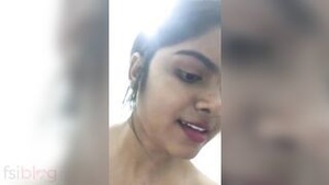 Beautiful Indian woman enjoys intimate moments in shower room