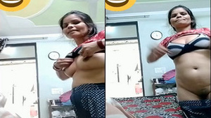 Indian amateur auntie flaunts her big tits and pussy in exclusive video