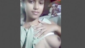 Teenage girl flaunts her large breasts and intimate area