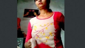 A stunning Indian girl flaunts her breasts and pussy in a steamy video