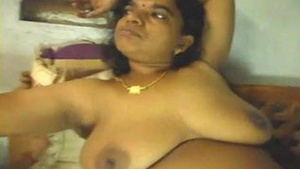 Mature Desi Aunty gets naughty in a village setting