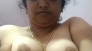 Mature aunty teases in sari and pleasures herself with fingers